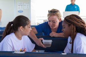 Aly Busse interacting with students during an education program in 2018. Credit: Conor Goulding / Mote