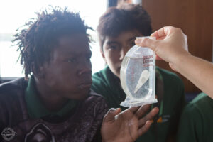 Student examining water sample