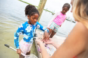 Education dip netting in New Pass waters